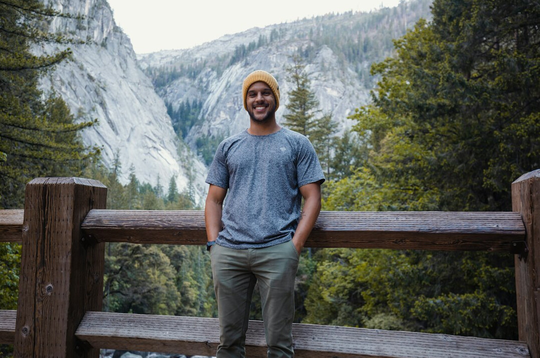 Portrait of a man travel writer smiling outdoors