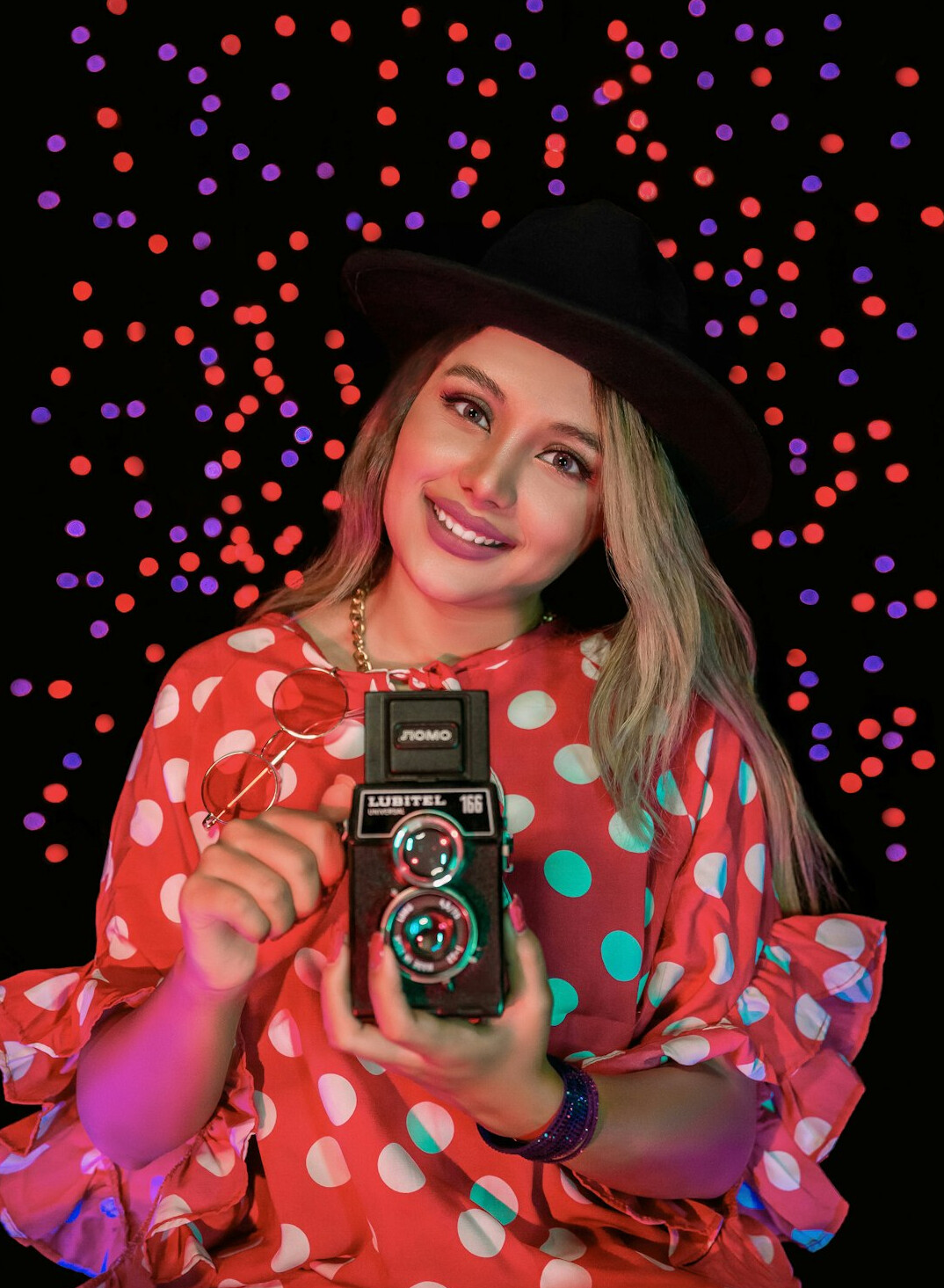 Portrait of a woman photo editor smiling in a studio