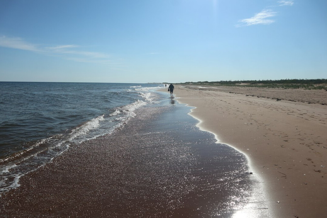 Red sand cliffs and blue ocean on Prince Edward Island coastline