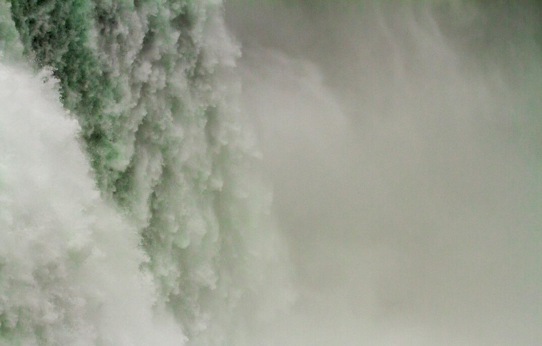 Niagara Falls with mist rising from the powerful waterfall